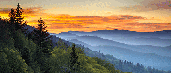 a beautiful sunset over misty mountains