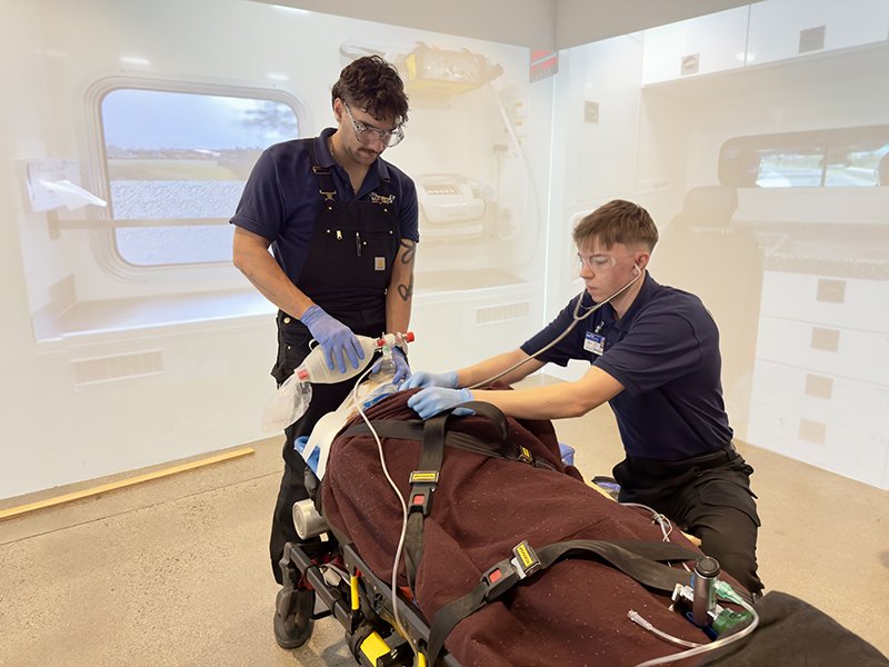 ems students in sim room