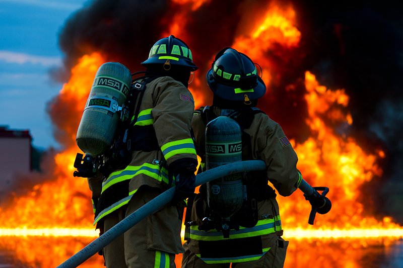firefighters with fire and hose
