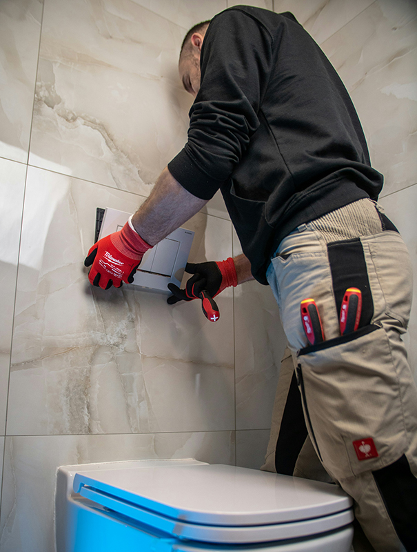 plumber in bathroom