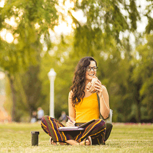 girl snacking in the grass
