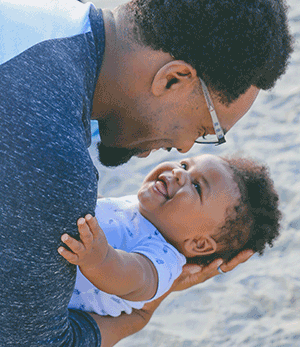 family support services father with child at beach
