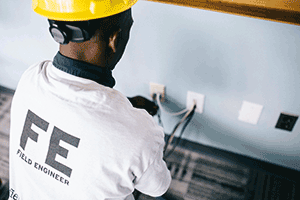 Electrician installing plugs