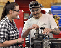 auto workers at an engine