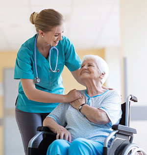 Nursing Assistant I Program, a nurse assisting an elderly lady