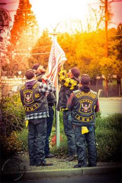 erecting a new flag at the Harley Davidson store