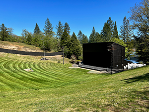 a view of the Rogue Bowl stage after the lawn has been freshly mowed
